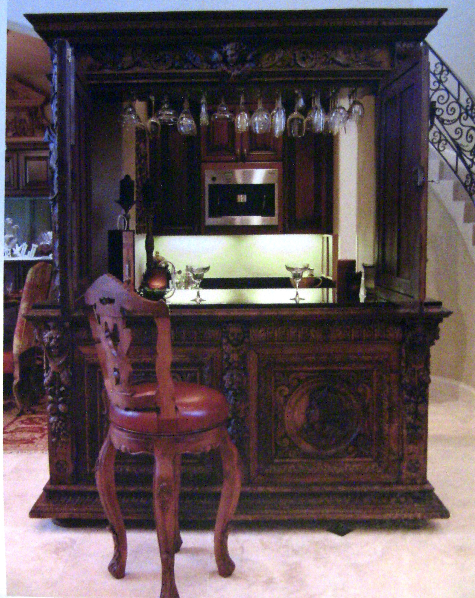 Custom Conversion of French Renaissance Buffet Deaux Corps into a Serving Bar. Custom-cut granite top added along with retro fit to fill the space.