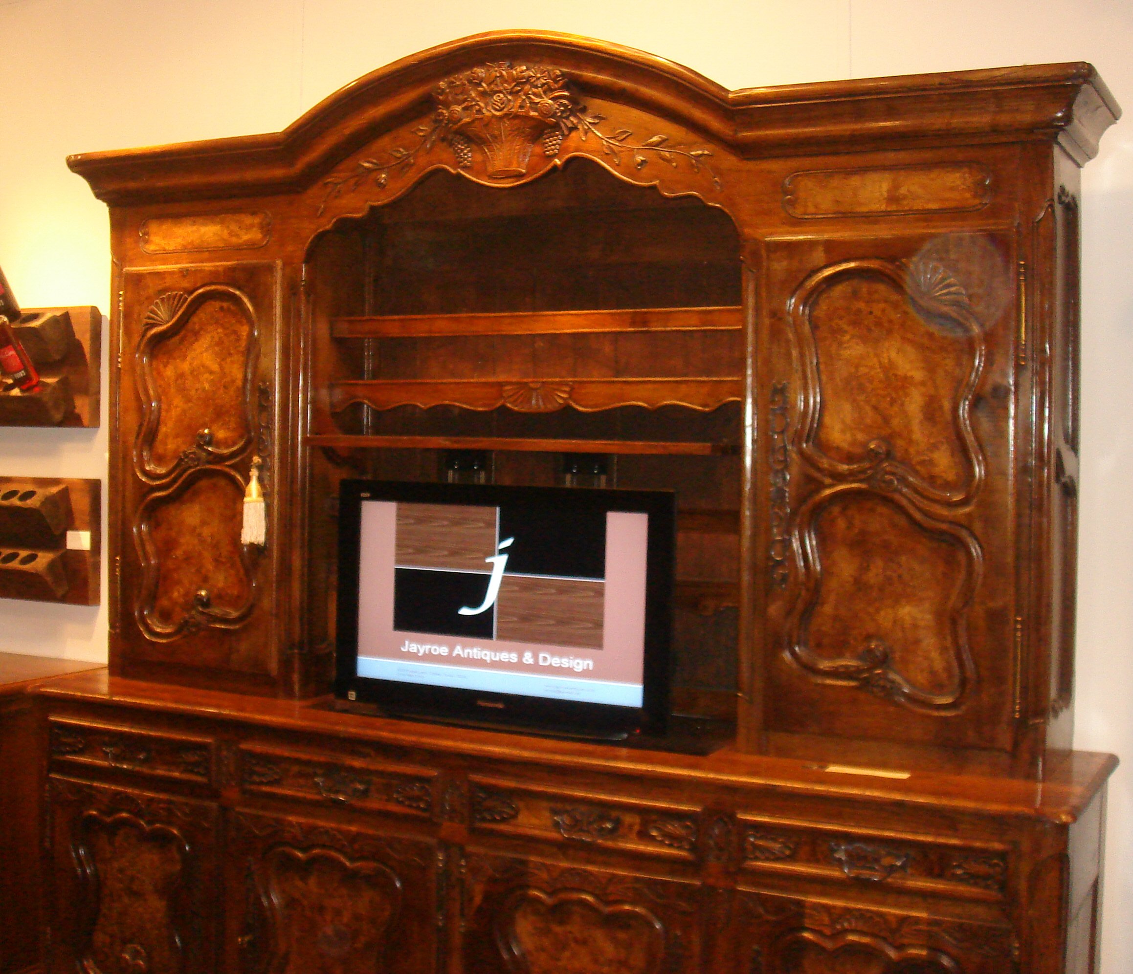 TV lifter inside custom-built Vasselier in walnut and maple veneer.